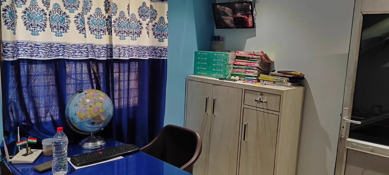 The study corner with globe, books and Indian flag at Ronak Coaching Center