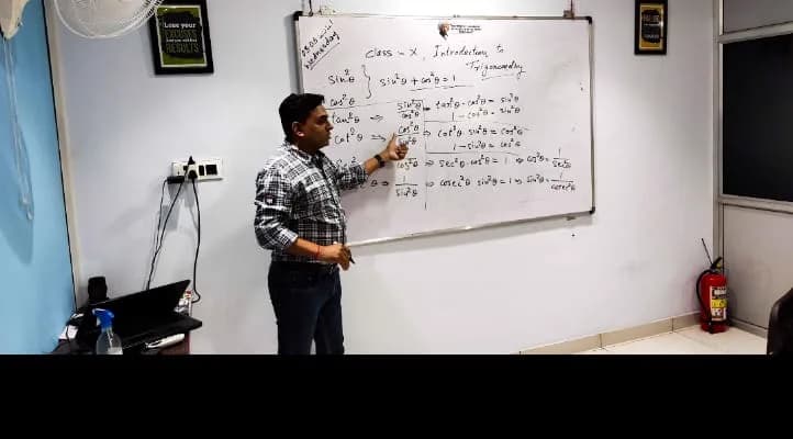 Manish Parmar teaching Class 10 trigonometry on the whiteboard